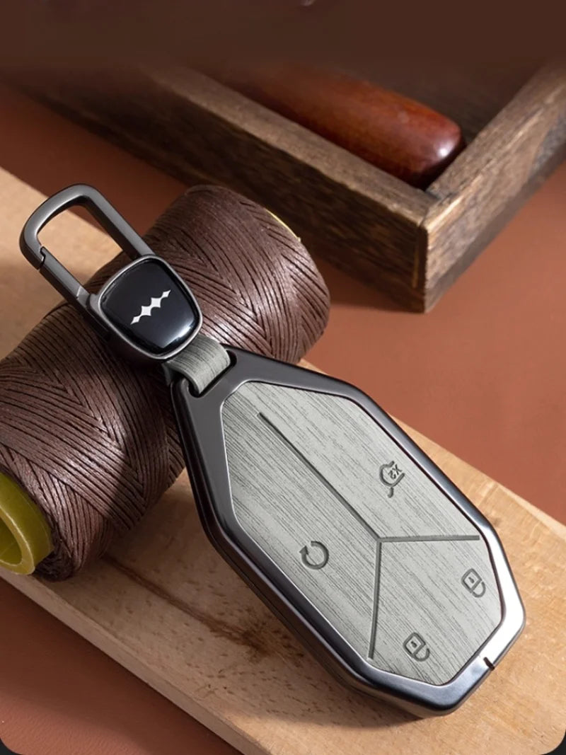 BYD Leopard 5 / 8 / Ti3 / Ti7 — Wood Grain Zinc Alloy Key Fob Case & Keychain (2025–2026)
