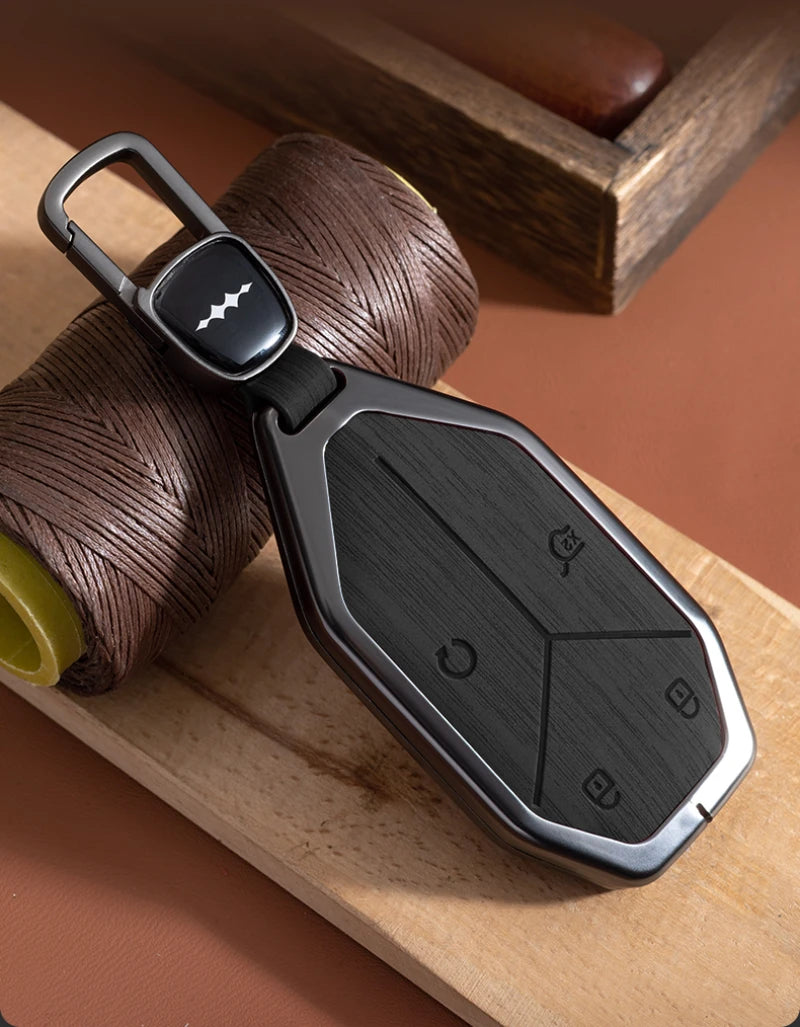BYD Leopard 5 / 8 / Ti3 / Ti7 — Wood Grain Zinc Alloy Key Fob Case & Keychain (2025–2026)